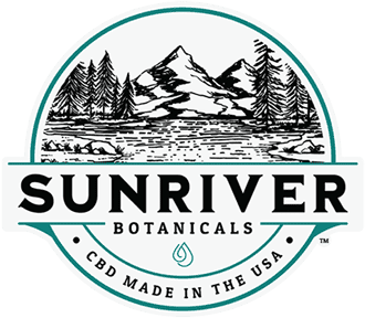Sunriver Botanicals logo. Black text and drawing of a mountain landscape with round green border.